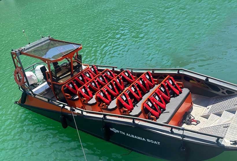 Day trip from Tirana to Komani Lake and Shala River, featuring scenic bus rides and clear turquoise waters.
