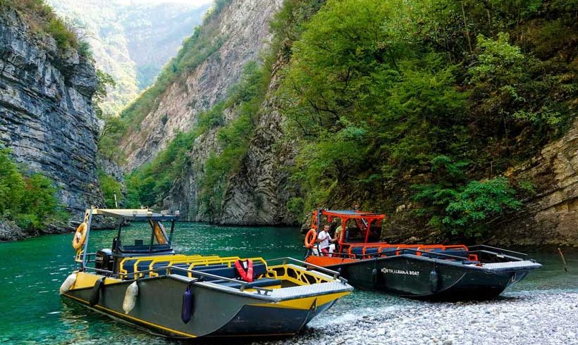 Day trip from Durres to Komani Lake and Shala River, showcasing breathtaking fjord landscapes and crystal-clear waters.