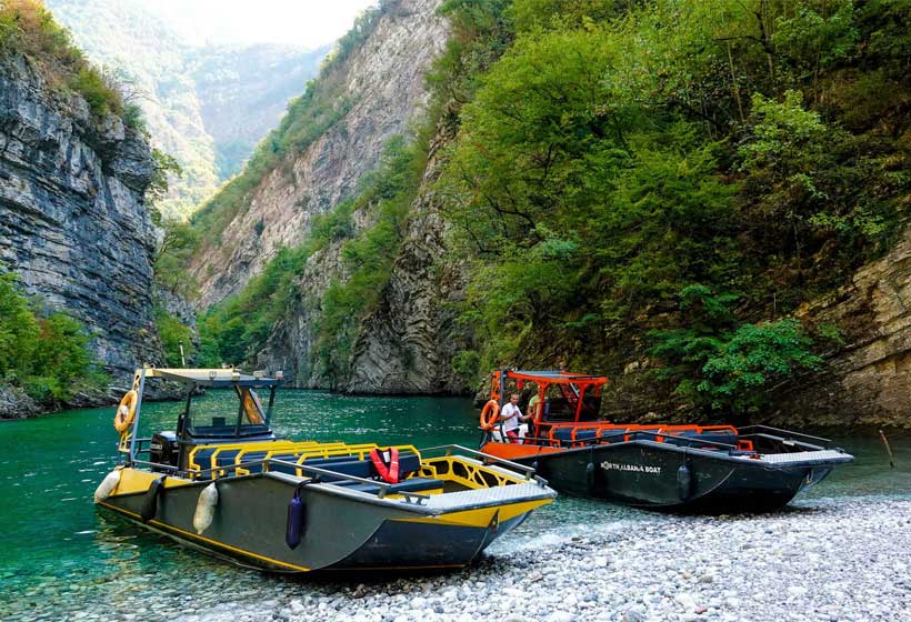 Day trip from Durres to Komani Lake and Shala River, showcasing breathtaking fjord landscapes and crystal-clear waters.